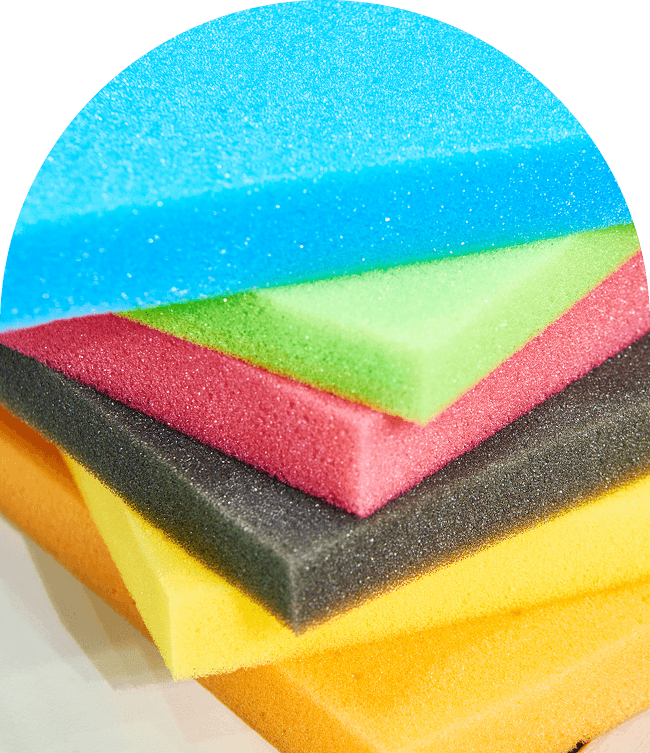 Colorful foam sheets stacked in layers.